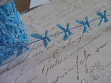 Load image into Gallery viewer, Wired String With Sky Blue Mini Raffia Bows, approx 5/8 inches wide

