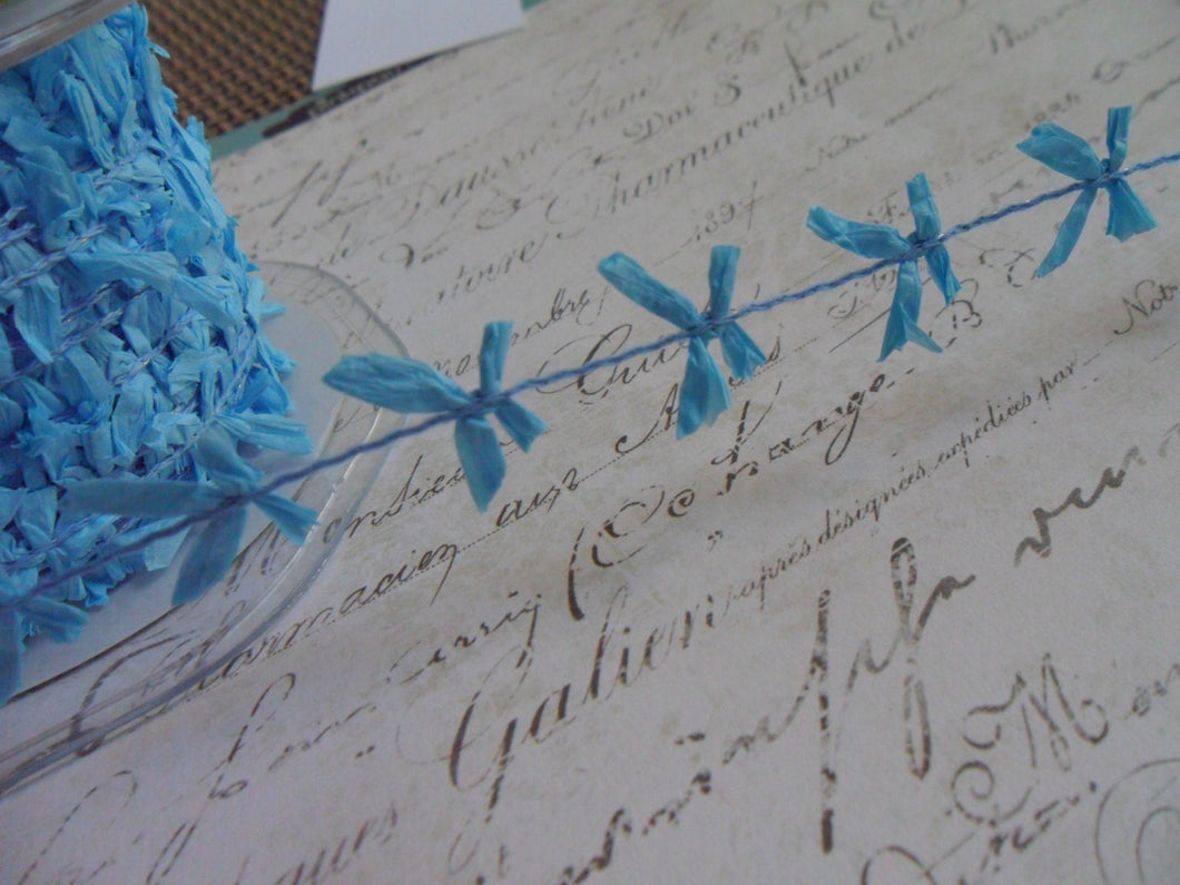 Wired String With Sky Blue Mini Raffia Bows, approx 5/8 inches wide