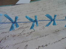 Load image into Gallery viewer, Wired String With Sky Blue Mini Raffia Bows, approx 5/8 inches wide
