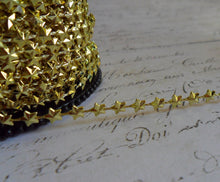 Load image into Gallery viewer, Petite Bright Gold Star Garland, approx 1/4 inch wide
